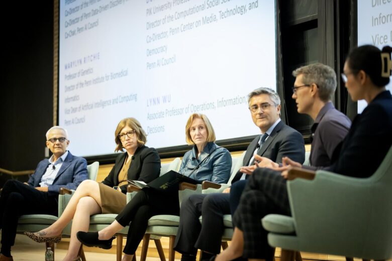 Picture of faculty members and administrators on the stage of Stavis Auditorium in Amy Gutmann Hall. From left: Bhuvnesh Jain, Marylyn Ritchie, Dawn Bonnell, René Vidal, Duncan Watts, and Lynn Wu.